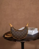 Rebce Louis Vuitton Loop half-moon bag